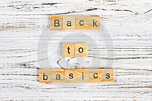 The words back to basics made of letters on wooden blocks. back to basics - fundamental principles concept