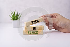 The words back to basics made of letters on wooden blocks. back to basics - fundamental principles concept