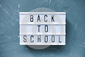 Words BACK TO SCHOOL on gray background