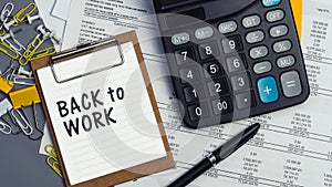 The words Back to work written on a white notebook