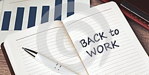 The words Back to work written on a white notebook. Work and study concept