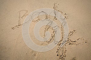 The words beach life written in the sand