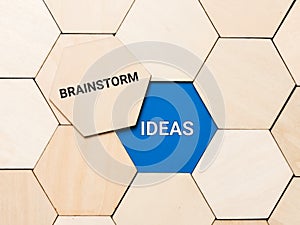 Words brainstorm and ideas on wooden hexagon. Business innovation concept.