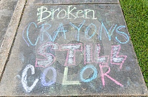 The words "Broken crayons still color" motivational phrase