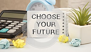 words CHOOSE YOUR FUTURE, computer keyboard and stationery on white table. Career concept