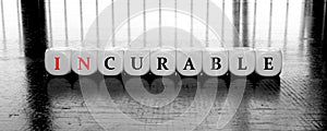 Words curable or incurable - dilema concept photo