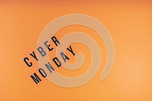 Words CYBER MONDAY on a bright orange background