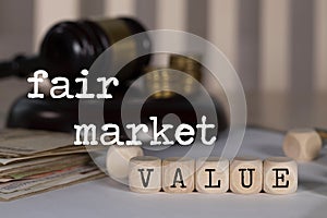 Words FAIR MARKET VALUE composed of wooden dices