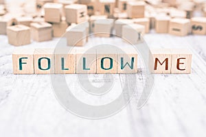 The Words Follow Me Formed By Wooden Blocks On A White Table, Social Media Concept