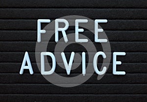 The words Free Advice in white letters on a notice board