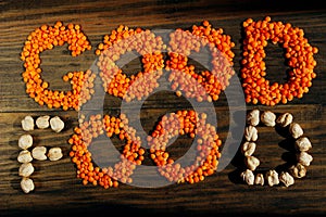 Words `good food` are shaped from beans based food, top view. `Good food` words are mades of different type of beans.