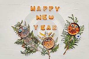 The words happy new year are written from cookie letters. Flat lay composition for greeting card