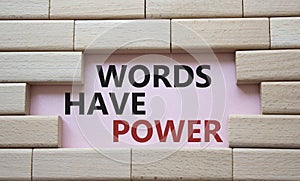 Words have power symbol. Wooden blocks with words Words have power. Beautiful pink background. Business and Words have power