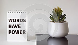 Words have power text in notepad on white background