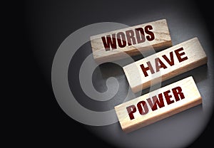 Words Have Power - text on wooden blocks on dark grey background. Powerfull force of communication, storytelling
