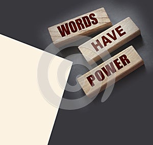 Words Have Power - text on wooden blocks on dark grey background. Powerfull force of communication, storytelling