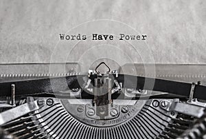 Words have power typed on old vintage aged typewriter