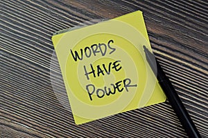 Words Have Power write on sticky notes isolated on Wooden Table