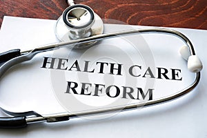 Words health care reform written on a paper. photo