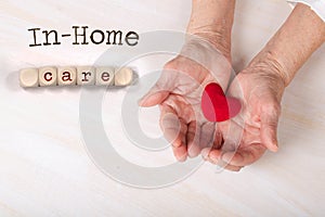 Words IN-HOME CARE composed of wooden dices photo