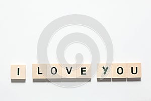 Words i love you made of wooden blocks isolated on white background