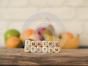 The words immune system on small wooden blocks, healthy eating concept