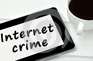 The words Internet crime on tablet pc