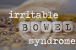 Words IRRITABLE BOWEL SYNDROME composed of wooden dices