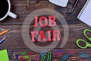 The words Job fair on table
