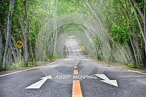 Words of keep moving with white arrow on road