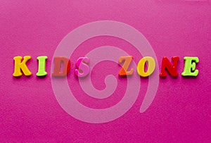 Words `kids zone` on pink background