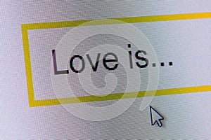 Words Love is... in search bar on computer monitor