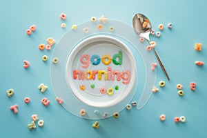 Words made of colorful cereal. Good Morning message in a bowl. Simple and fast breakfast. National cereal day. Minimal creative