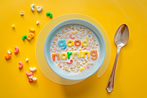 Words made of colorful cereal. Good Morning message in a bowl. Simple and fast breakfast. National cereal day. Minimal creative