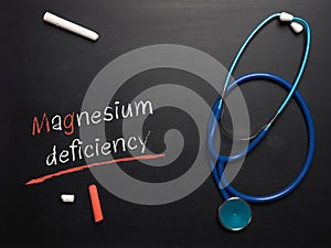 The words Magnesium deficiency on a chalkboard