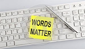 Words WORDS MATTER written on stickers on a computer keyboard