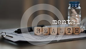 Words MENTAL HEALTH composed of wooden dices photo