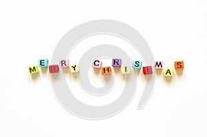 Words `merry christmas` with colorful iblocks solated on a white background.