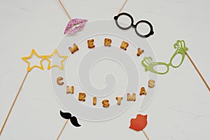 The words merry christmas and happy new year are written from cookie letters. Flat lay composition for greeting card