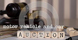 Words MOTOR VEHICLE AND CAR AUCTION composed of wooden dices