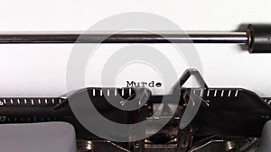 The words `Murder 101 ` being typed on a typewriter