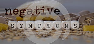 Words NEGATIVE SYMPTOMS  composed of wooden dices