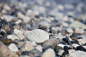 Words on pebble stones â€“ motivational concept slogan â€“ word sea