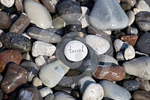 Words on pebble stones â€“ motivational concept slogan â€“ word travel