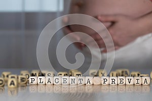 Words PLACENTA PREVIA composed of wooden letters