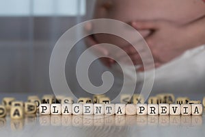 Words PLACENTA PREVIA composed of wooden letters photo
