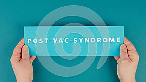 The words post vac syndrome are standing on a paper, covid-19 vaccine damage and side effects, pandemic jab