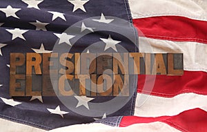 The words presidential election on a USA flag photo