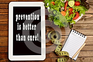 The words Prevention is better than cure on tablet pc