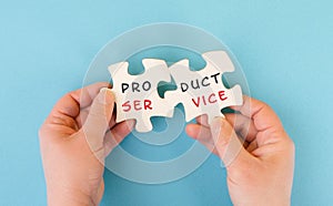 The words product service are standing on two puzzle pieces, customer satisfaction and support, business strategy